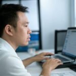 AI Skills 2025 learning desk with AI logo pen, laptop, and futuristic vibes